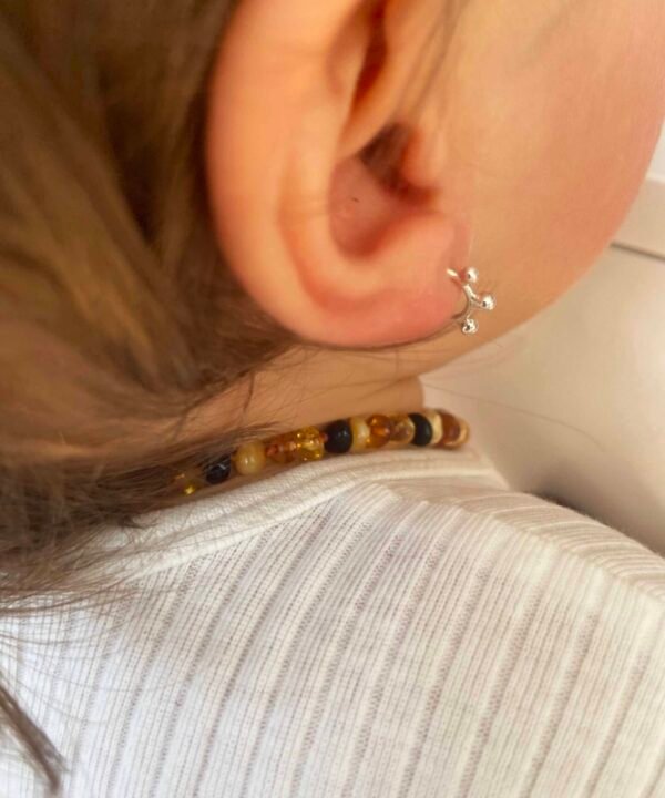 baby girl with little hoop earrings