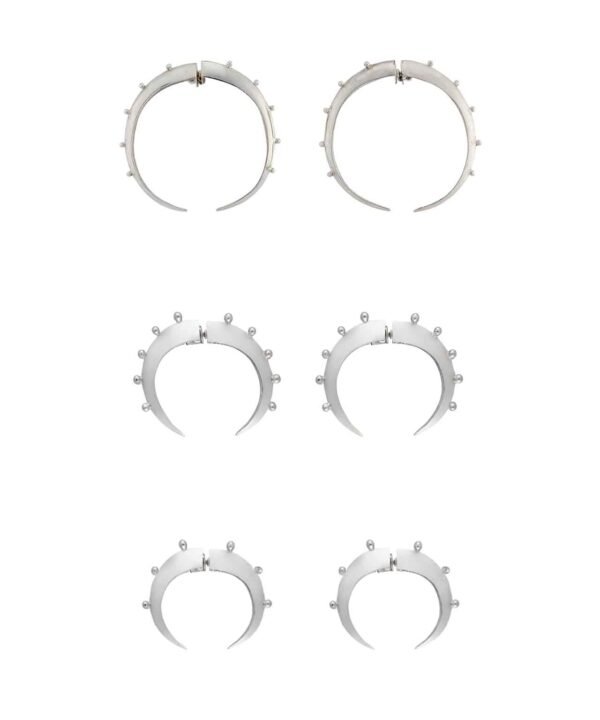image of the different sizes of crescent hoop silver earrings. First the big ones, followed by the medium and then the baby hoops.
