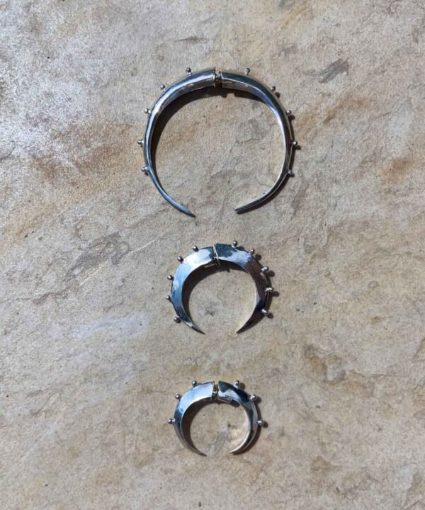 the three sizes of the crescent hoop silver. Made by aysha bilgrami in recycled silver in bogota colombia