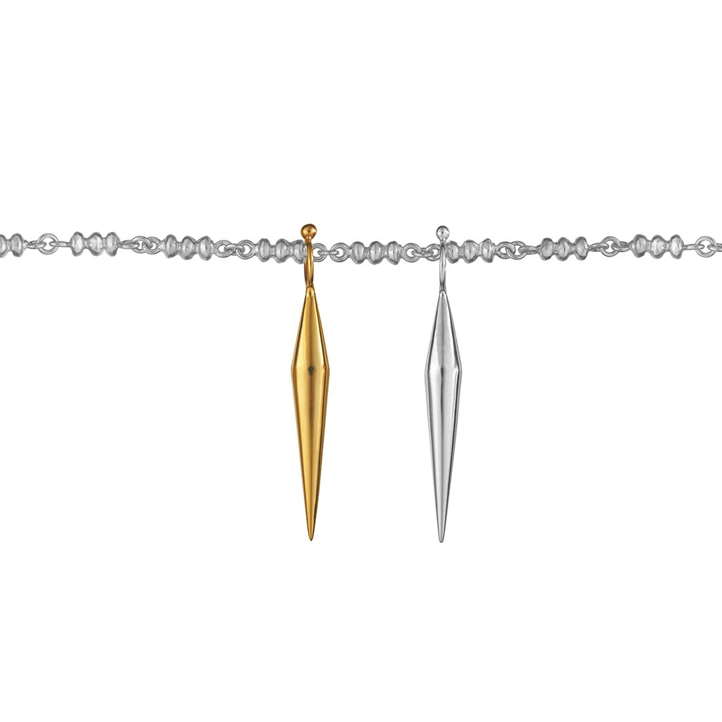 two conical silver and gold vermeil pendants hanging from a sphere chain. Made in recycled silver by pakistani-colombian jewelry designer aysha bilgrami in Bogotá, colombia